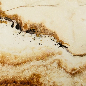 Kitchen with a combination of marble and some gold accents