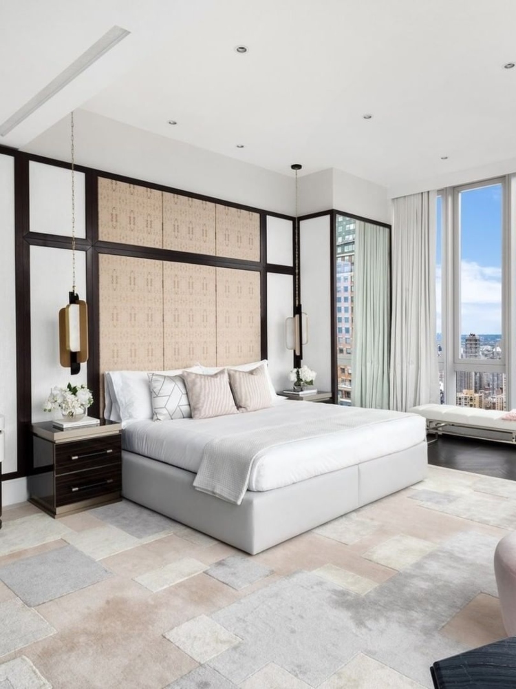 Master bedroom with a breathtaking view and chic minimalism style.