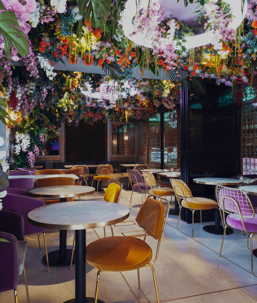 A Contemporary Restaurant Design With A Rainbow of Flowers