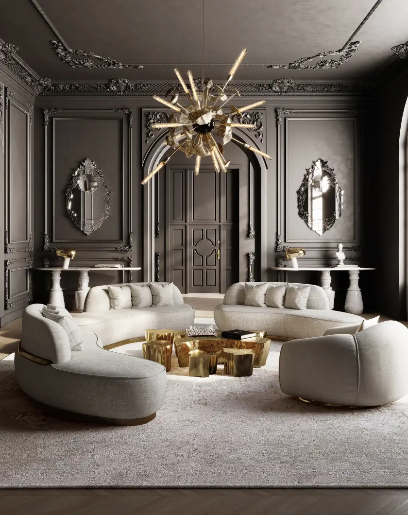 A luxurious living room with a dark color scheme, featuring a large, curved sofa with multiple seating areas, a unique coffee table, and a dramatic chandelier.